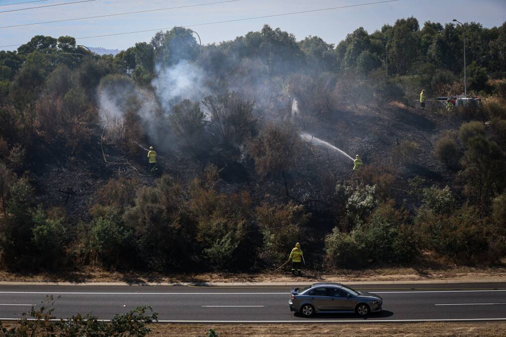 Fire at the Racecourse Road exit on the Hume Freeway on Saturday morning. Picture: JAMES WILTSHIRE