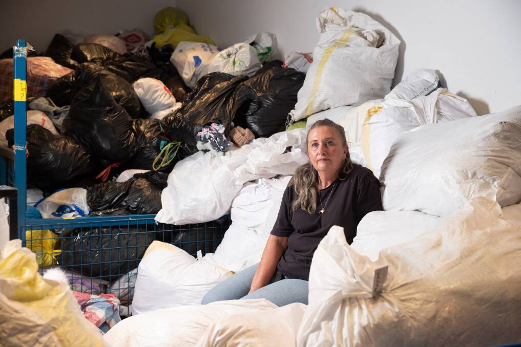 Vinnies southern NSW area manager Karen Lewis among bags of donations that came to the Peter Street sorting facility over a period of just two days. Picture by Madeline Begley 