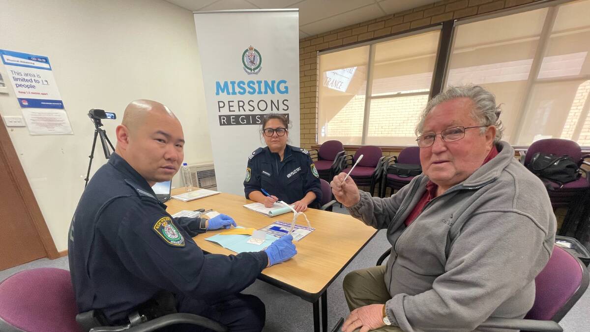 COLLECTION CENTRE: DNA Management Unit Senior Constable Patrick Tsang and Sergeant Mary Koksal taking a DNA sample from Coolamon resident Thomas Bourke. Picture: Taylor Dodge