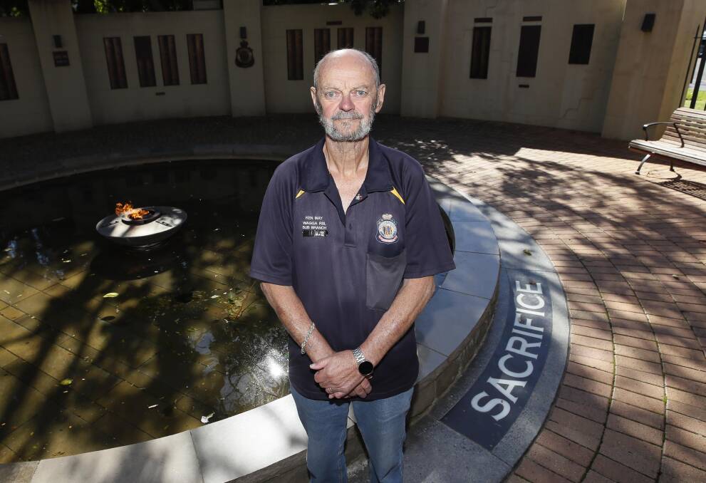 SERVICE: Wagga veteran, RSL Sub-Branch vice-president and chairman of the Anzac Day committee Ken May pays his respects to fallen servicemen and women. Picture: Les Smith