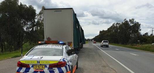 Police stop the B-double on the Sturt Highway at Ashmont on Monday. Picture by NSW Police 