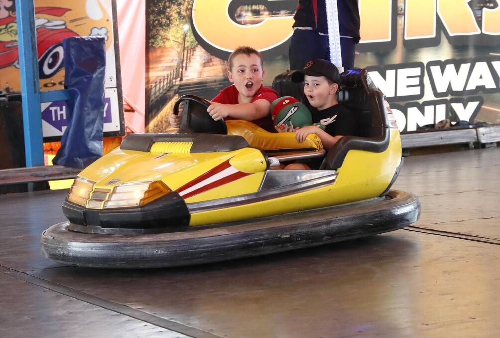 Junee brothers 9 yo Harry Willis and 4 yo Parker Willis had the best time working as a team on the Dodgem Cars. Picture by Les Smith 