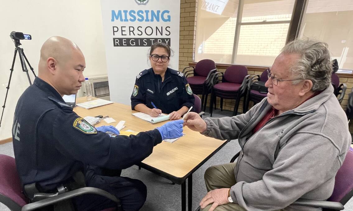 COLLECTION CENTRE: DNA Management Unit Senior Constable Patrick Tsang and Sergeant Mary Koksal taking a DNA sample from Coolamon resident Thomas Bourke. Picture: Taylor Dodge