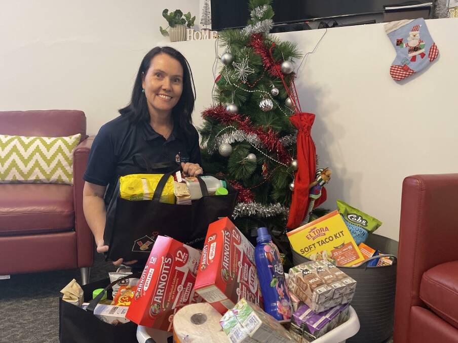 Ronald McDonald House Wagga executive officer Lisa Simpson with some of the donations from South Wagga Public School. Picture: Taylor Dodge 