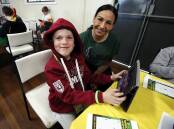 GAME TIME: Jameson Scriven, 8, with Minecraft mentor Noelene Callaghan at the Lake Albert Hall. Picture: Les Smith