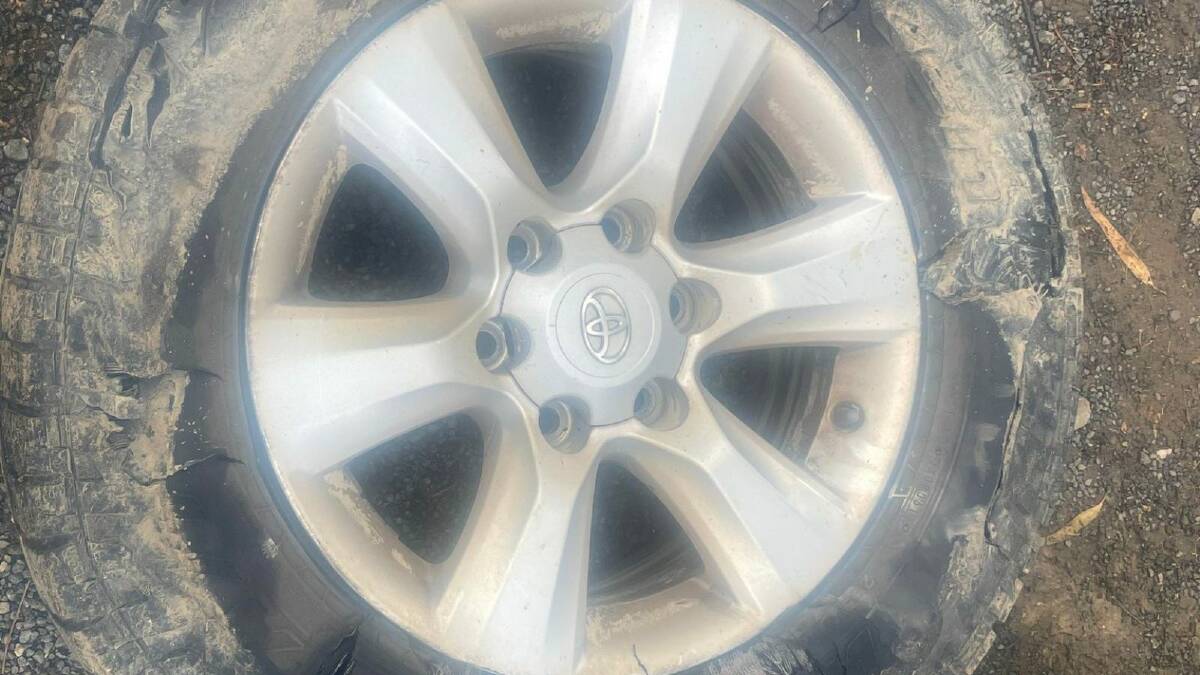 Riverina resident Amanda Kay's car tyre was left completely "shredded" after she had no choice but to drive over a huge pothole on Tumbarumba Road towards the Hume Highway end. Picture supplied 