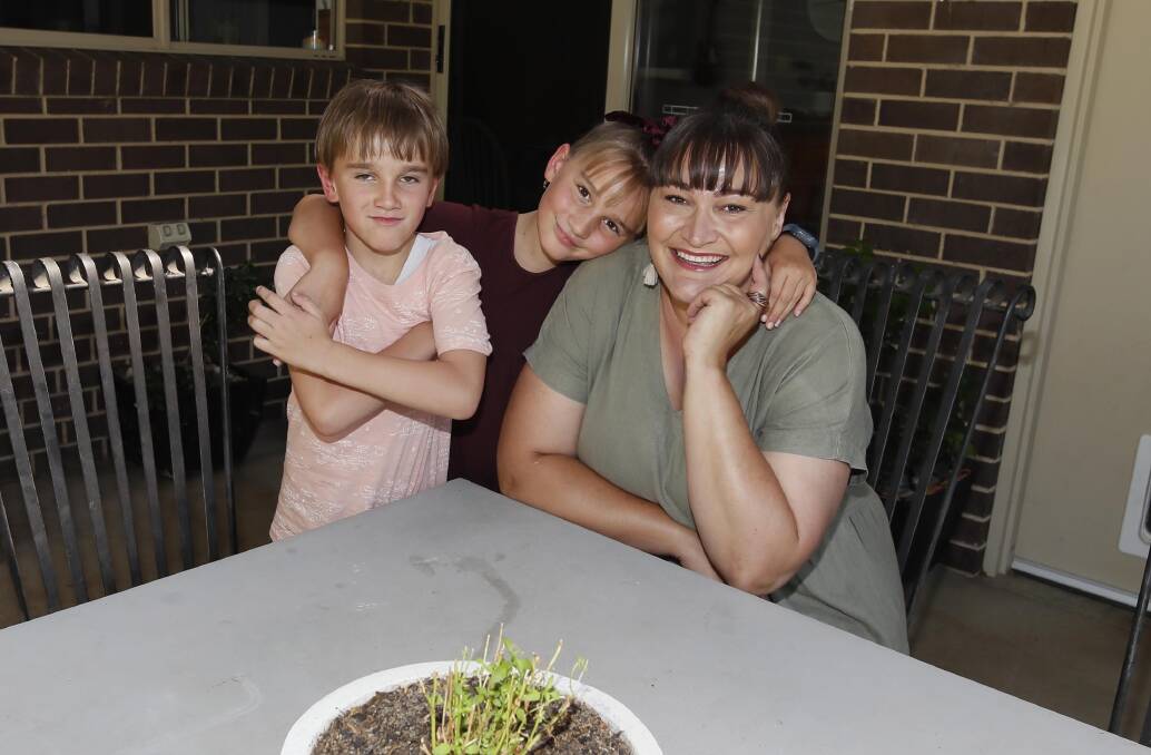  Natasha Coetzee, 7-year-old Theo McDonald and 8-year-old Mimmy McDonald can't wait until the day they can welcome dad Alex McDonald home. Picture: Les Smith