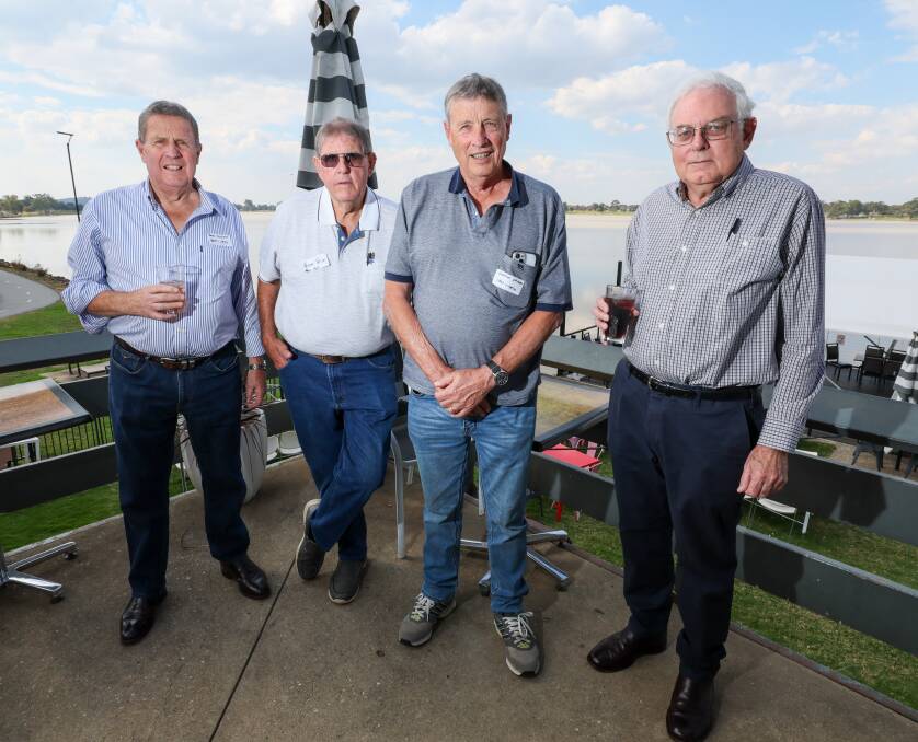 Robert Hackett, Peter Price, Graeme Hackett and Ian Condon reconnect at the Great Southern Motors 100-year-reunion at the Wagga Boat Club. Picture by Les Smith 