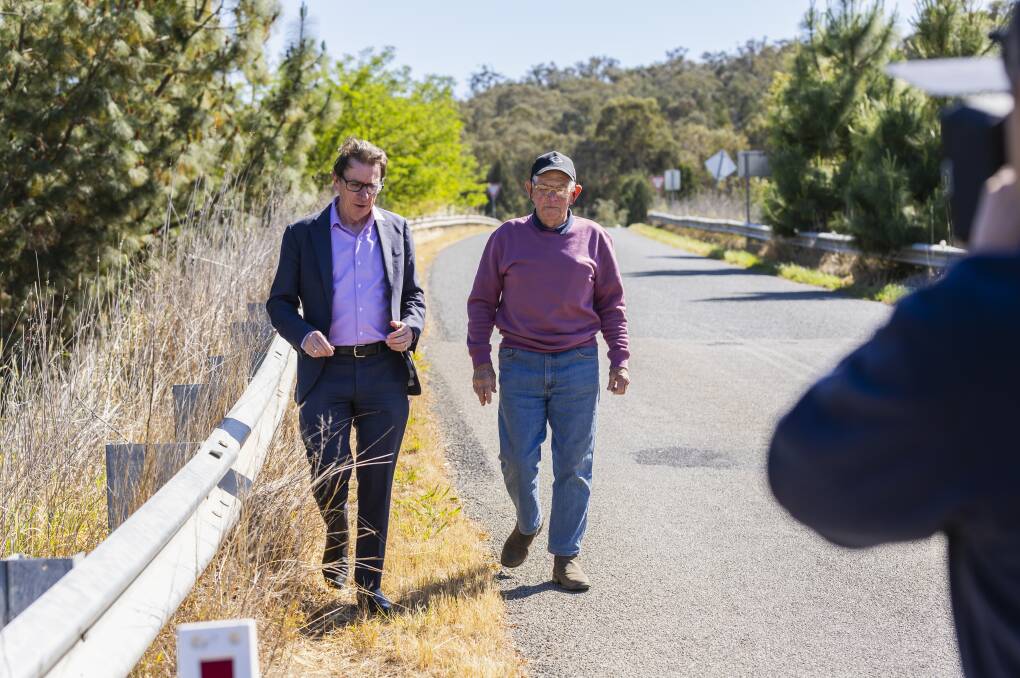 Member for Wagga Dr Joe McGirr with San Isidore resident Tom Hughes just down from the nortorious Sturt Highway and Kapooka Road intersection. Picture by Ash Smith 