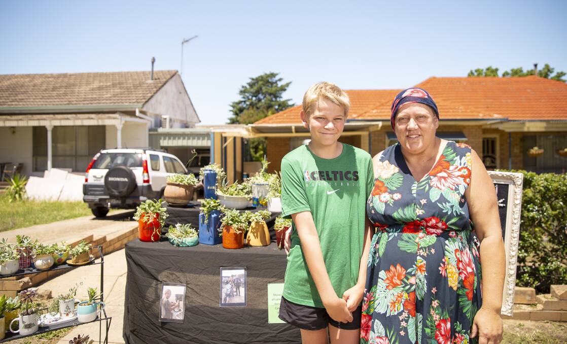 Wagga's Quade Smith, 12, with mum Naomi Michel fundraising for Can Assist using their plant stall. Picture: Ash Smith 