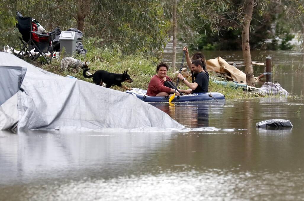 Two Wilks Park rough sleepers have made the decision to remain put with their pet dogs and goat as water inundates the North Wagga campsite. Picture by Les Smith