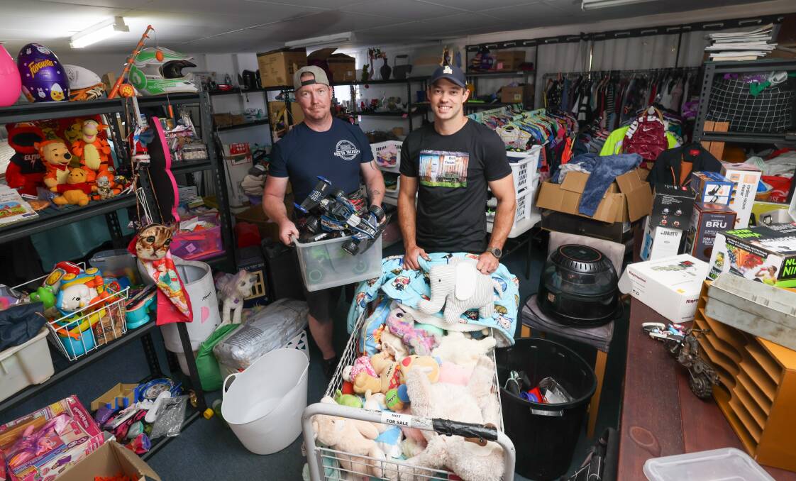 Buried Treasures and Collectables owner Josh Light and Mitch Griffiths will be holding the cheapest garage sale you've ever seen. Picture by Les Smith 
