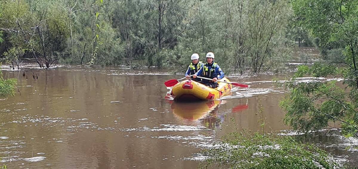 DELIVERY: Wagga, Deniliquin VRA swift water technician duo Tim Lidden and Chris Holloway delivering critical medicine to elderly couple near Singleton. Picture: Contributed 