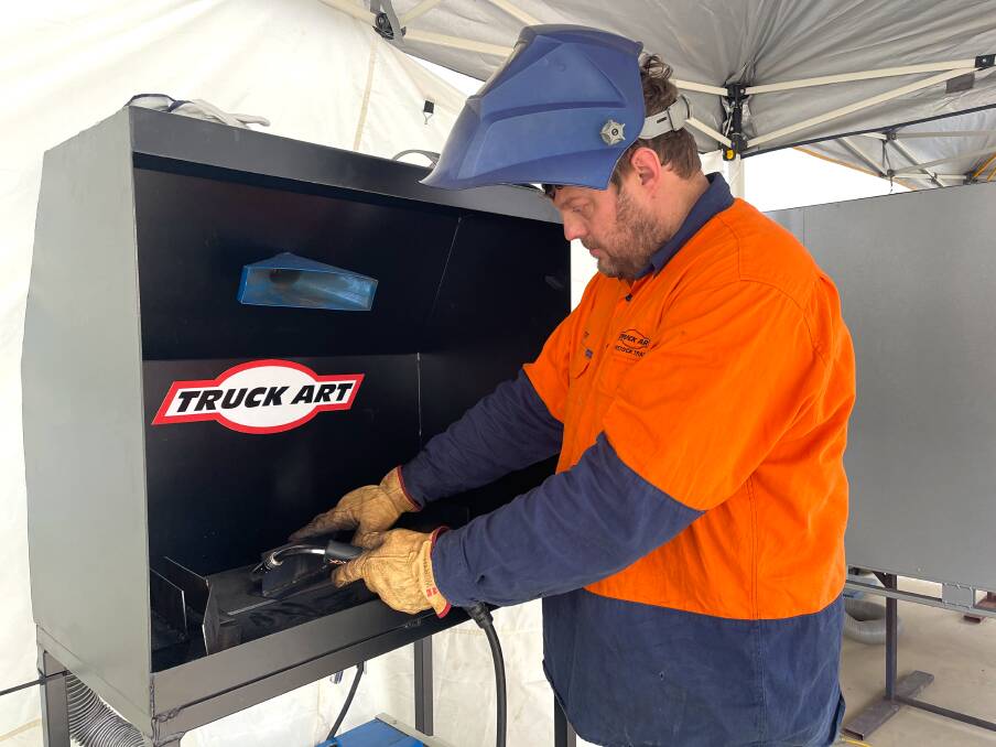 IN ACTION: Wagga Truck Art welder and fabricator Stephen Peacock showing an audience how the job is done. Picture: Taylor Dodge