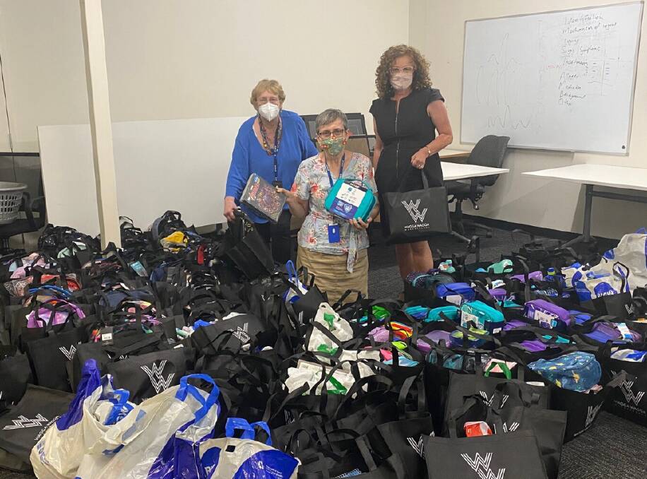 SUCCESS: Carole Parkinson and Cindy James from Wagga St Vincent de Paul with
Centre Manager at the Wagga Marketplace Maria Sharman and all of the donations. Picture: Contributed 