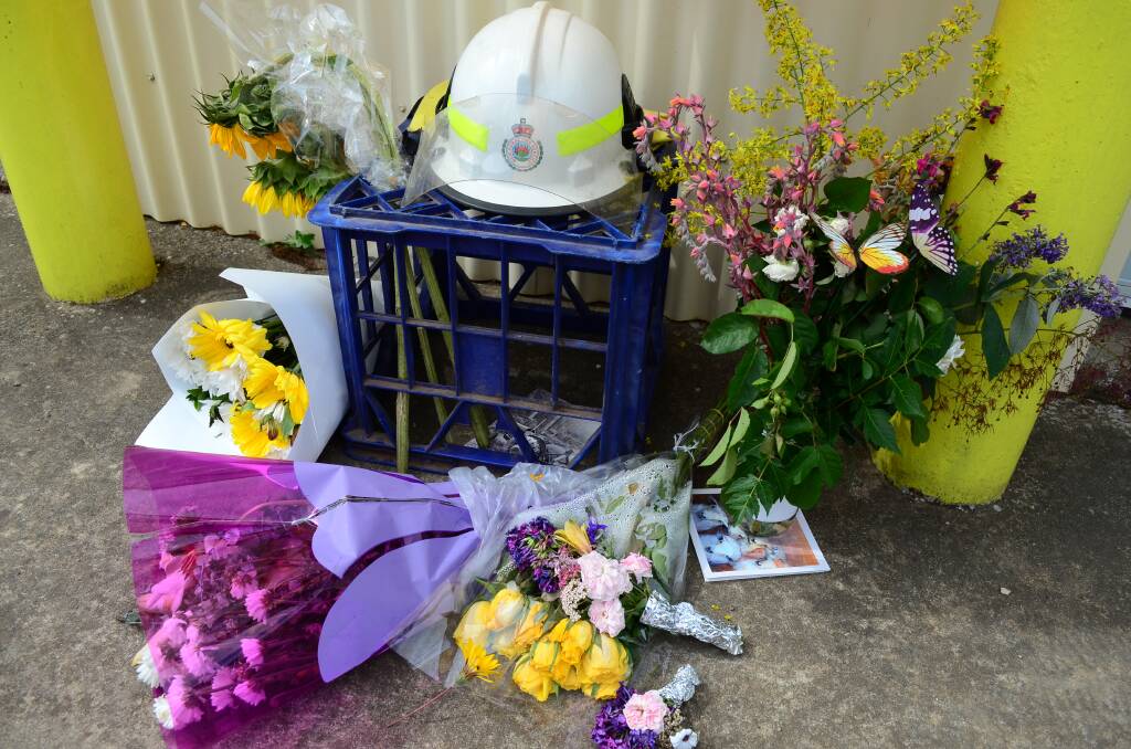 Flowers have been placed at the Ladysmith Rural Fire Service station in honour of Trish O'Brien and John Stanton. Picture supplied 
