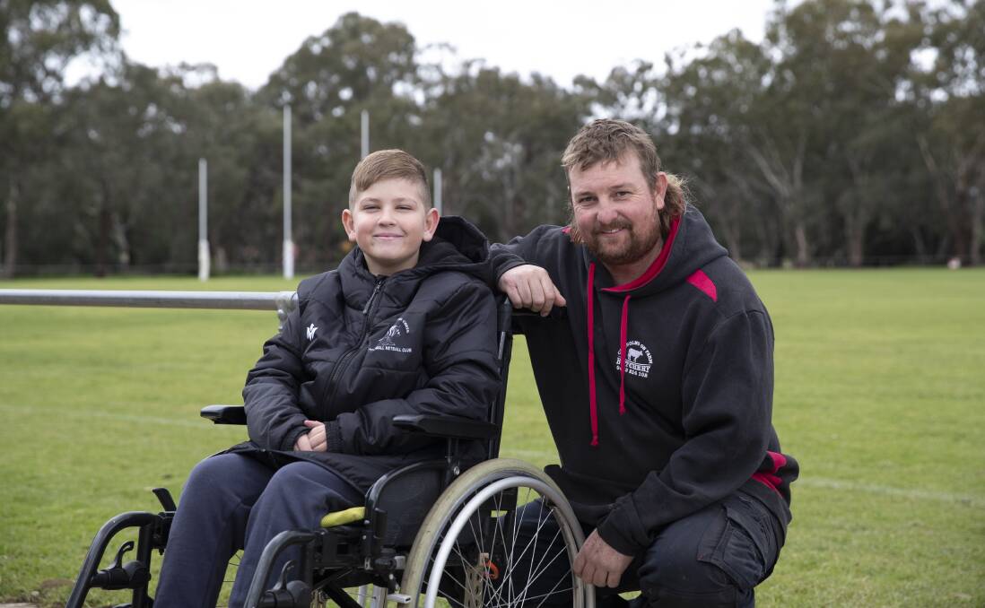 SUPPORT: The Rock's Chance Jones, 9, with former footy coach and friend Dale Hugo ahead of the fundraising event for the Jones family. Picture: Madeline Begley 