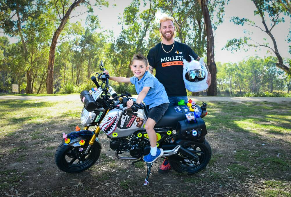 Wagga's Rhys Chan and five-year-old son Lucas Chan are raising funds and awareness for mental health. Picture by Bernard Humphreys 