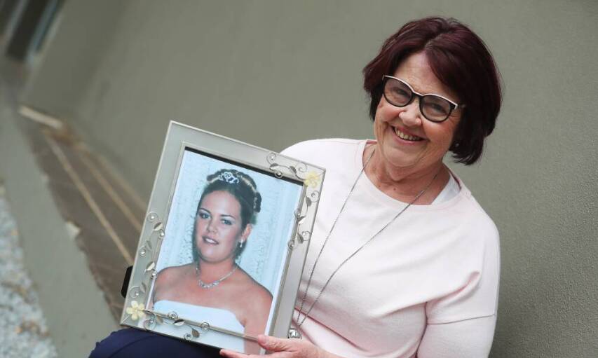 Annette St Clair - holding a picture of her late daughter Amie - has been named the 2024 Wagga Citizen of the Year. File picture 