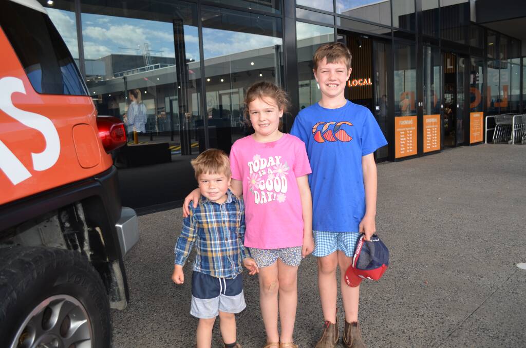 Siblings Mac Roberts, 3, Hallie Roberts, 6, and Charlie Roberts, 8, came in from out of town to visit their grandparents so they could get a first look at the new Foodworks at Estella. Picture by Taylor Dodge
