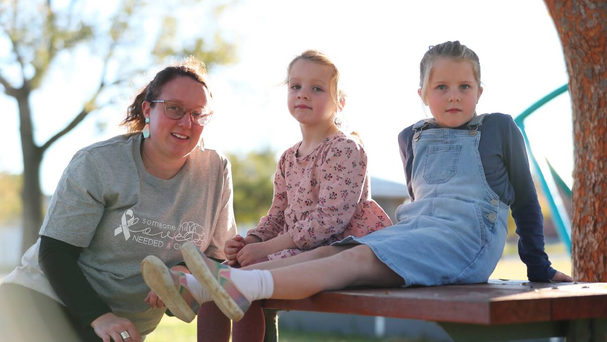 SHARING MEMORIES: Shaela Mauger has already filled out two books for her daughters Bella, 5, and Tahlia, 7, just in case the worst should happen. Picture: Emma Hillier 