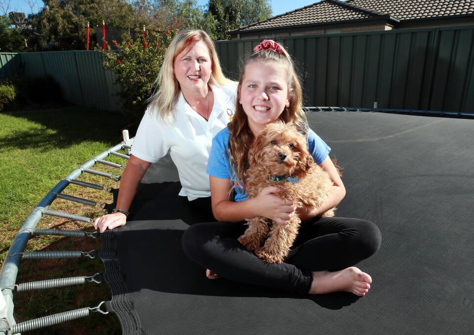 WISE WORDS: Georgia Rignall, pictured with her daughter Havana, 9, says good listening skills and patience are the keys to understanding people with autism. Picture: Les Smith