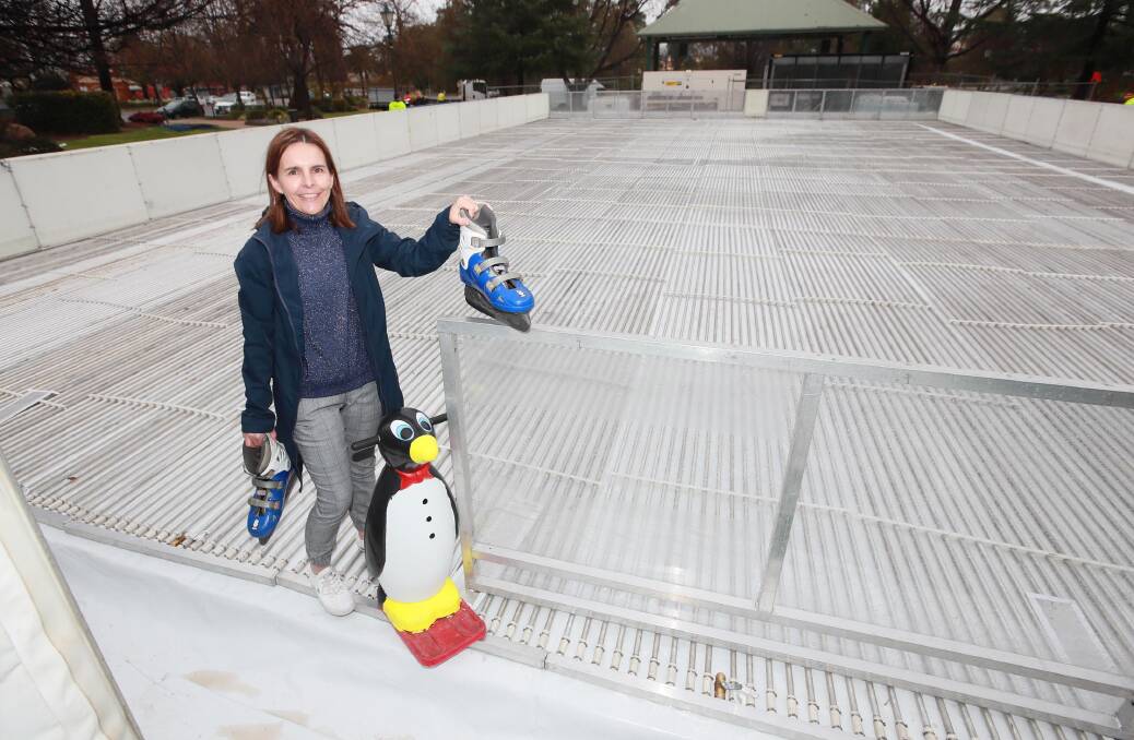 GRAB YOUR SKATES: Fiona Hamilton says the ice rink at the Victory Memorial Gardens is in the final stages of setup. Picture: Les Smith 