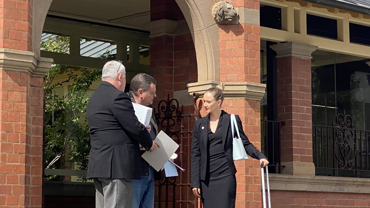 HEARING: Andrew Ross Clark (centre) with his legal team Michael King (left) and Elodie Somerville (right) at Wagga Court on Friday afternoon. 