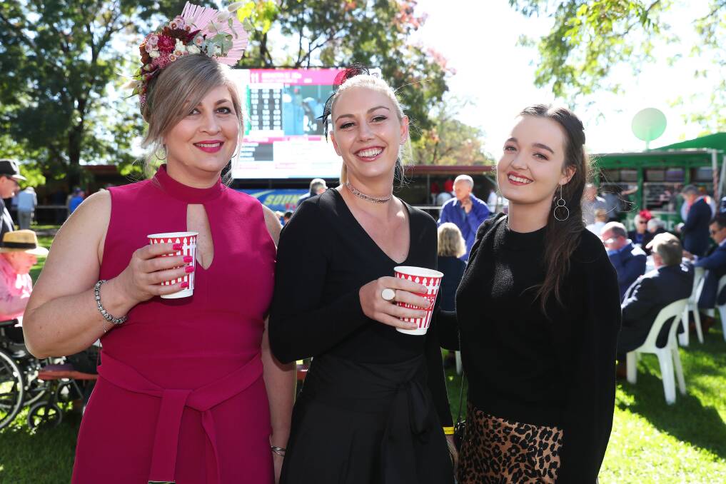 GLITZ AND GLAMOUR: Megan Yeo, from Canberra, Sarah-Jane Yeo, from Lismore, and Laura Yeo, from Wagga, enjoy a girls' day out at the Gold Cup in 2019. Picture: Emma Hillier 