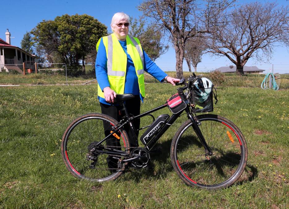 'SOLUTION': Ann Adams says members of the CWA Our Branch want to see riders, walkers on public roads wearing reflective vests. Picture: Les Smith 