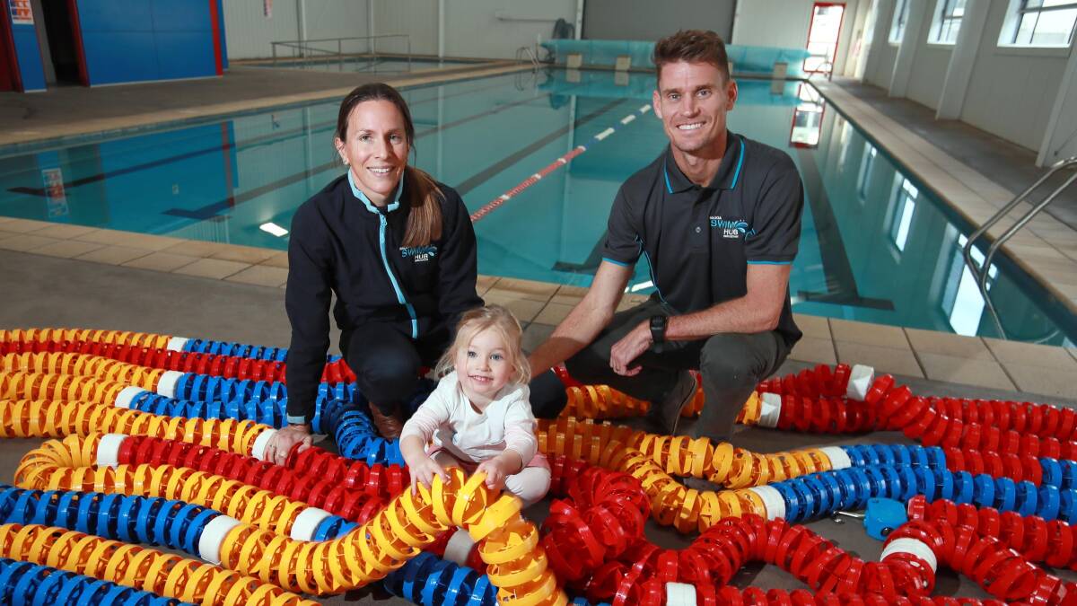 Brad Kahlefeldt, with his wife Radka and two-year-old Ruby in 2020 after they took over Wagga Swim Hub. Mr Kahlefeldt says they have noticed their students struggling in the water after a six-month hiatus due to COVID-19. 