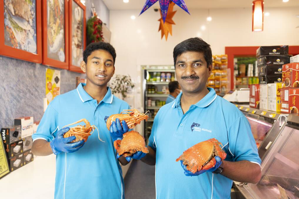 SEAFOOD FEAST: Roji Cherian with his son Harry, 15, are inundated with seafood orders for the Christmas season. Picture: Ash Smith 