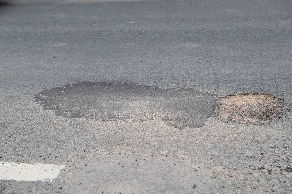 PROBLEM ROADS: A pothole on Morgan Street can pose a problem for drivers in Central Wagga. Picture: Emma Hillier 