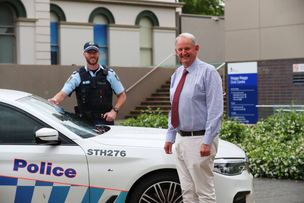 TAKE THE PLEDGE: Riverina Highway Patrol Acting Sergeant Jamie Mooney and Greg Conkey encourage all road users to be safe. Picture: Emma Hillier 