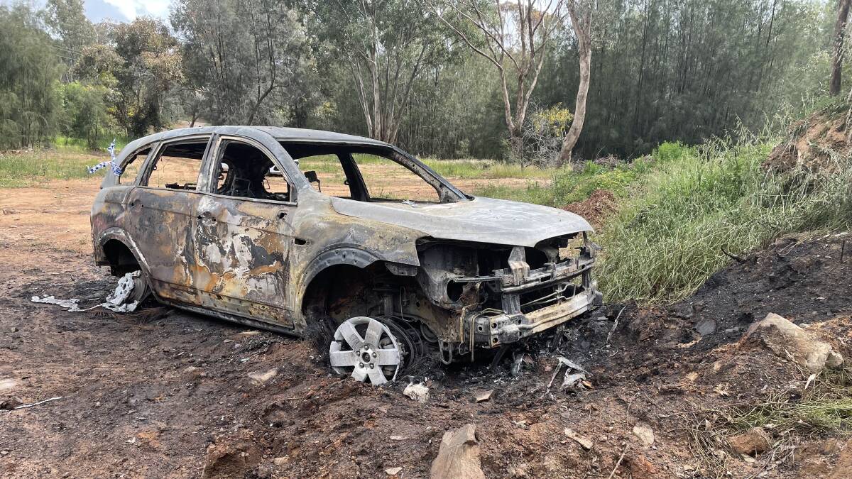 The car was set alight in a reserve off Mimosa Drive and has been completely damaged. Picture: Annie Lewis 