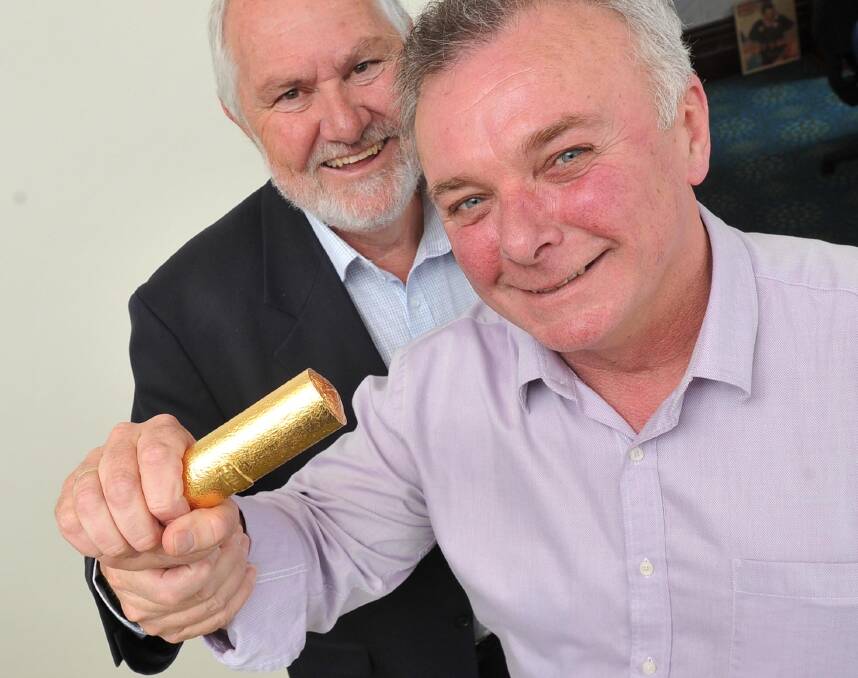 IT'S OURS: In 2015, Wagga mayor Rod Kendall and Museum of the Riverina manager Luke Grealy label Wagga's gold Chiko Roll as the true one. 