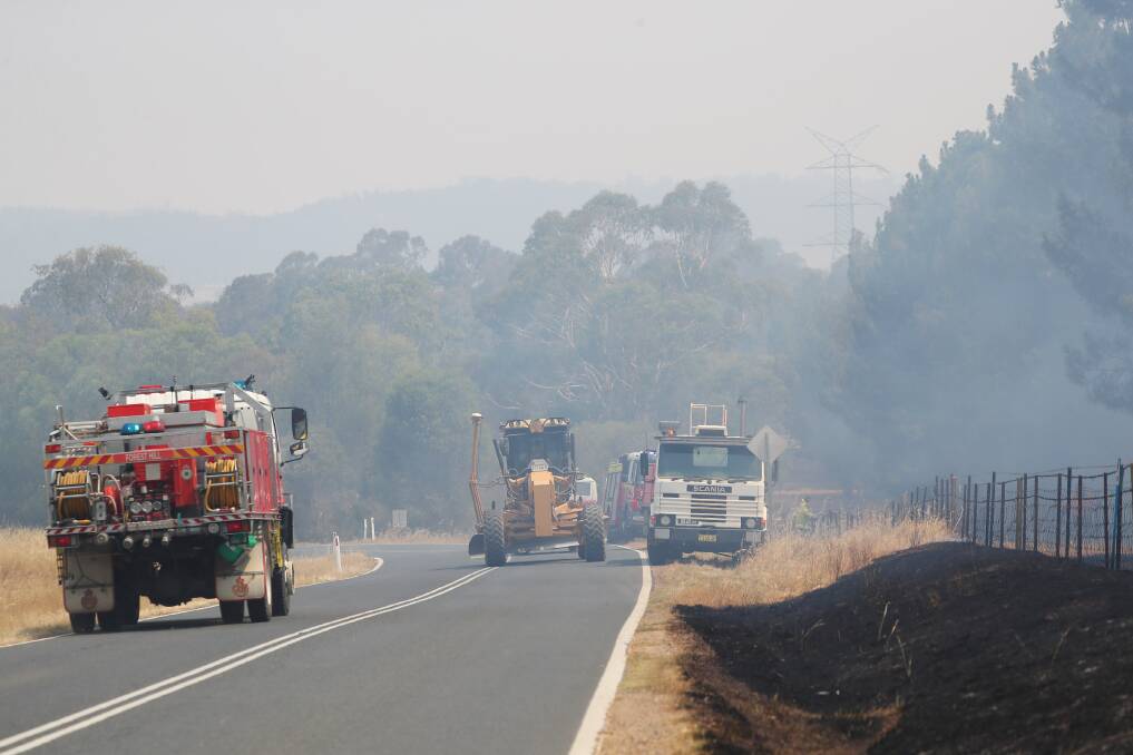 SMOKY HAZE: Emergency services at the scene of a grass fire on Gregadoo East Road in 2020. 