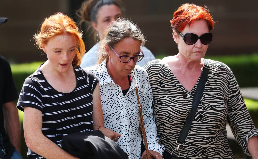SEARCHING FOR ANSWERS: Braydon Worldon's mother, Crystal (centre), walks into Wagga Courthouse flanked by her family and loved ones for day one of the inquest. Picture: Emma Hillier 