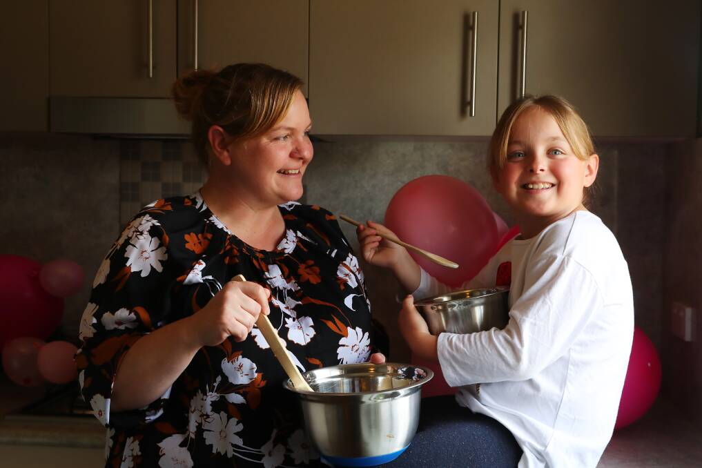 FOR A CAUSE: Lisa Quirk and her daughter Layla, 9, baked scores of treats before hosting a sale at their Forest Hill home. Picture: Emma Hillier 