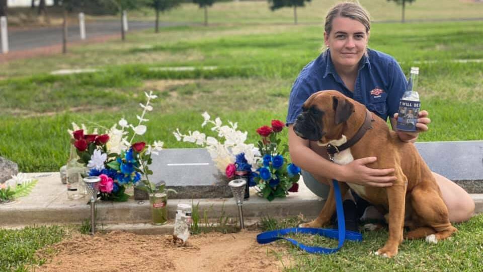 HEARTACHE: Maddie Bott visits Ethan's grave with dog Knox on what was meant to be their wedding day. Picture: Supplied 