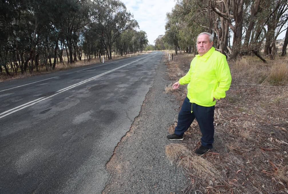 TIME TO ACT: Bruce Norton is fed up with the state of Tumbarumba Road and wants something done before it causes a crash. Picture: Les Smith 