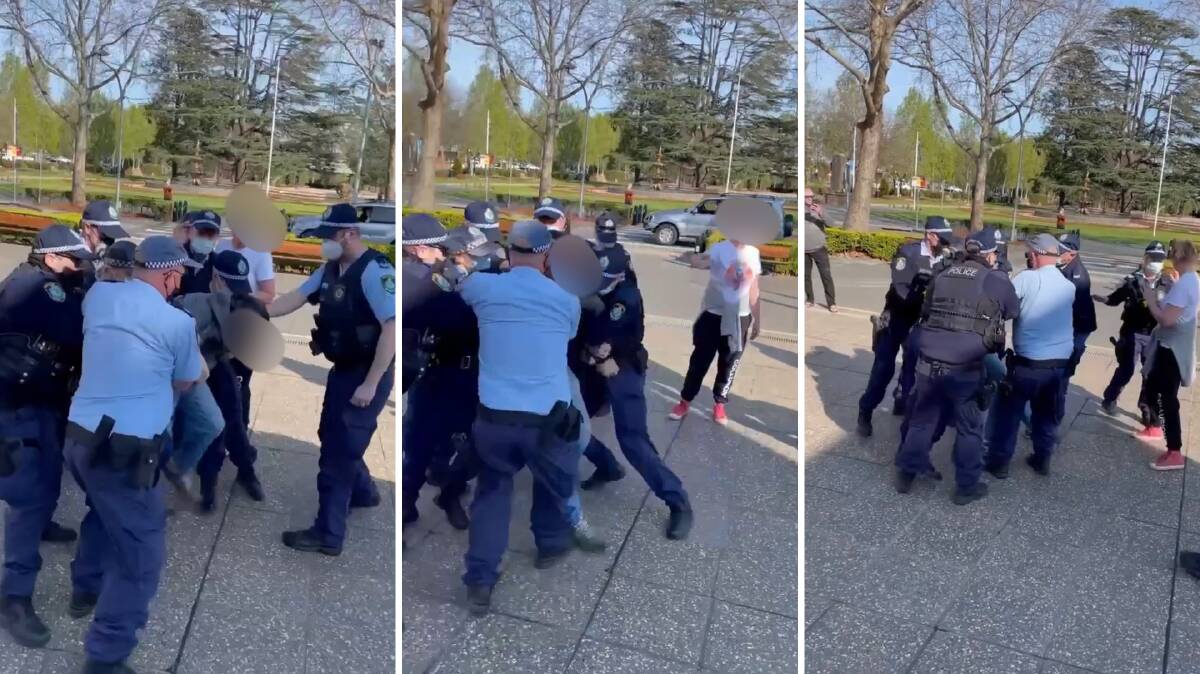 PROTEST: Police arrest a man at outside the Wagga City Council chambers. Picture: Supplied 