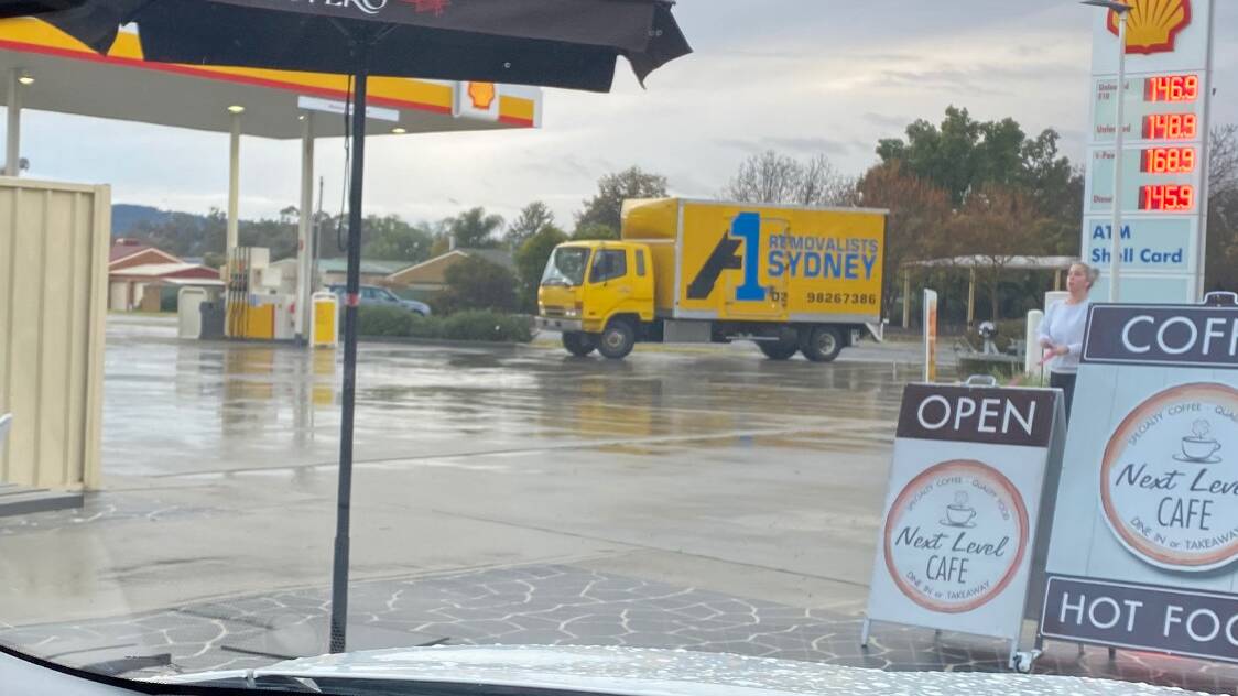 TALKING POINT: The A1 removals truck from Sydney which stopped on Friday at the same Jindera petrol station where infected removalists visited last Saturday.
