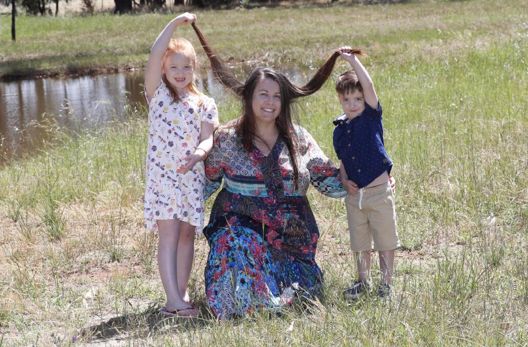 Amy Evans with her two children Isabel, 6, and Darcy, 4. Picture: Les Smith 