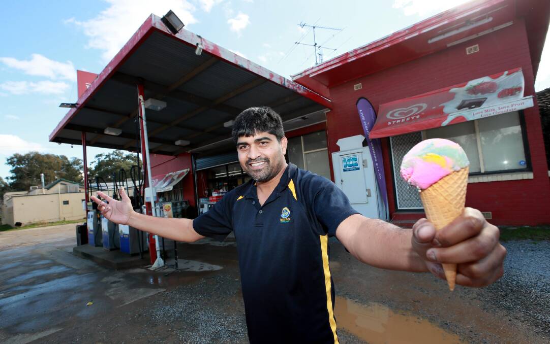 COOL TREAT: When Arvind Ramidi bought the petrol station next to The Shanty, he had no idea that it was famous for its ice-cream. But, over the years it's helped him to form bonds with regulars and strangers alike. Picture: Les Smith 