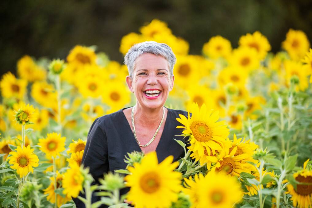 SEA OF YELLOW: Kylie Davis says she loves seeing the smile on people's faces as they wander in the garden. Picture: Zowie Crump/The Art of Zowie