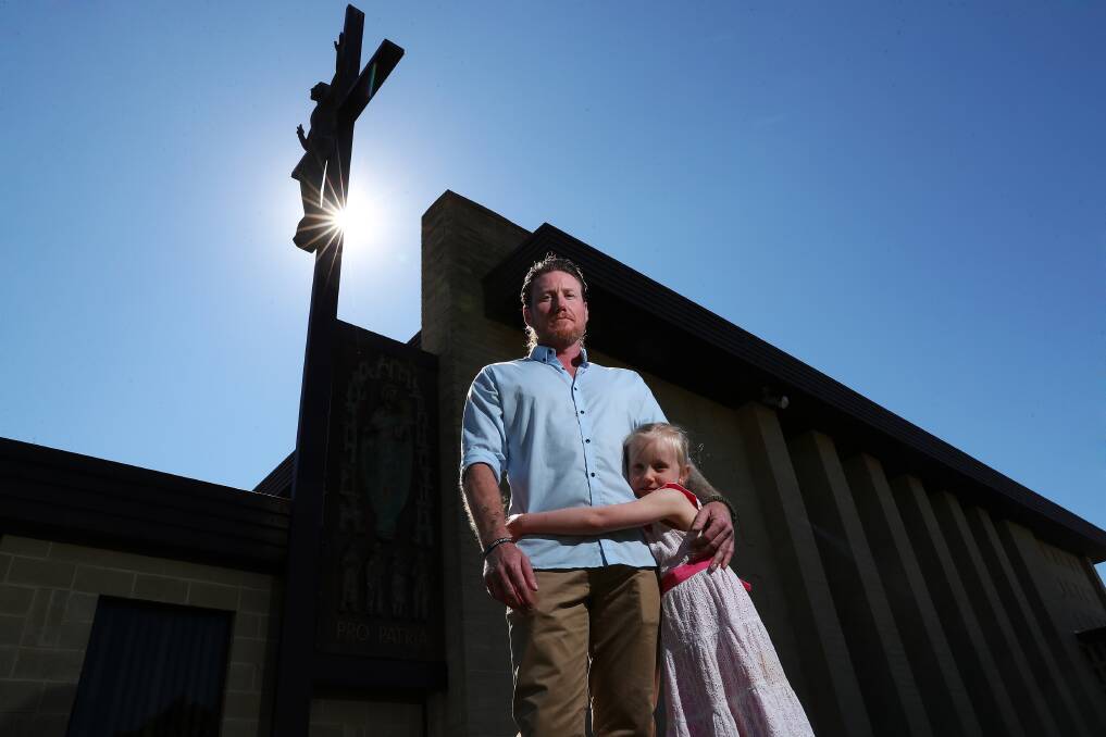 HARD WORK: Jason Frost with his daughter Sophie Frost, 6, at the official handover of the Carmelite Monastery to become the Pro Patria Centre Wagga. Picture: Emma Hillier 
