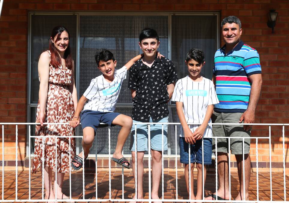 TOGETHER AGAIN: Zenah Shamo with family Randi, 9, Ronejan, 12, Redwan, 11, and Drei Darwesh are thrilled to be reunited in Wagga after four years apart. Picture: Emma Hillier 