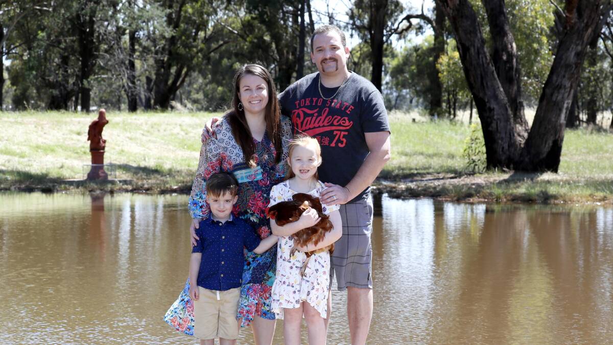 Amy and Brent Evans with their children Isabel, 6, and Darcy, 4.
