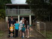 Firefighter Russell O'Keefe, partner Betty Stewart with their children at Coraki, downstream from Lismore. Februarys floodwaters rose well above the veranda of their home. Picture: Marina Neil